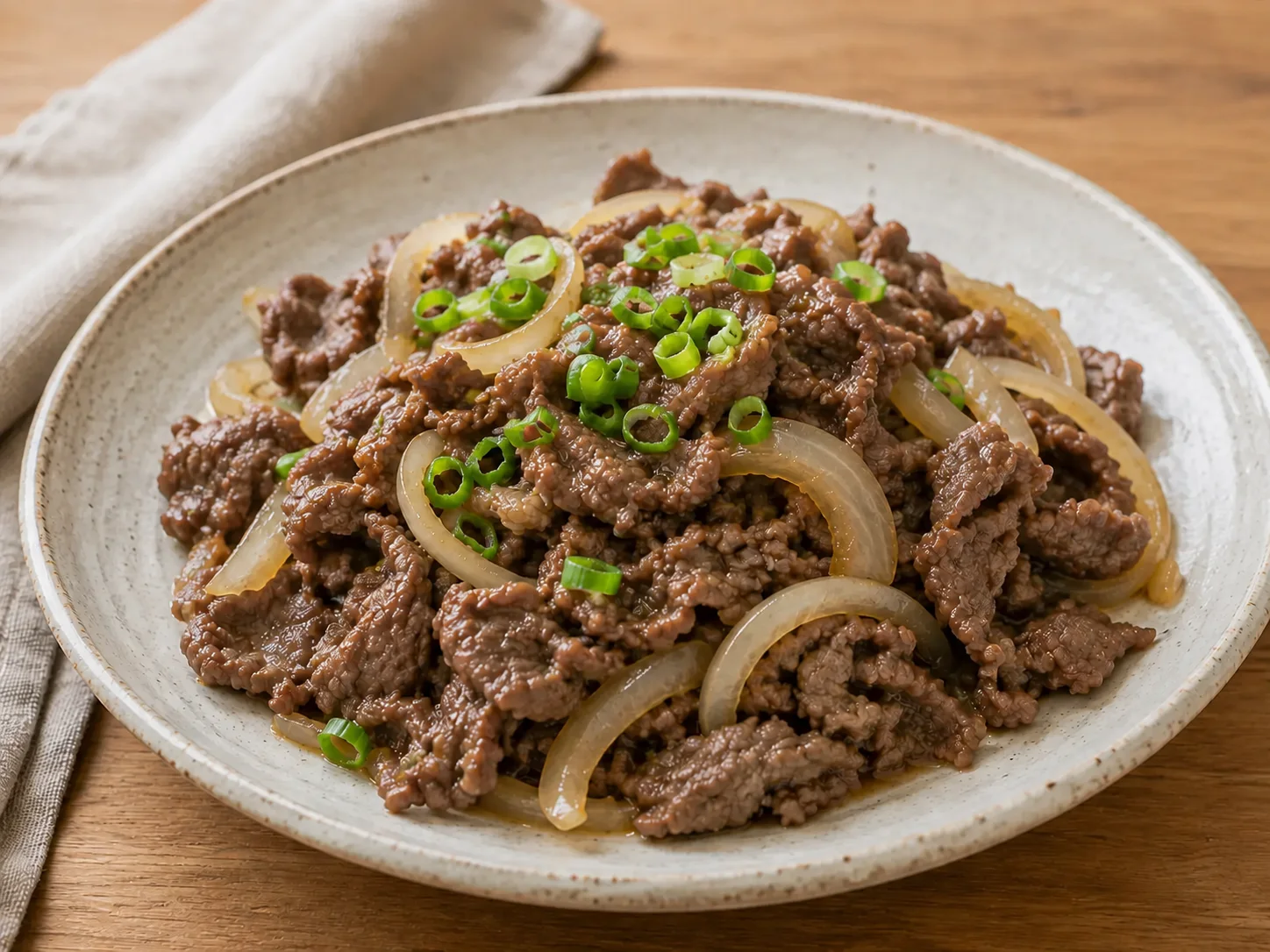 Bulgogi, korean marinated beef with caramelized onion and green onion